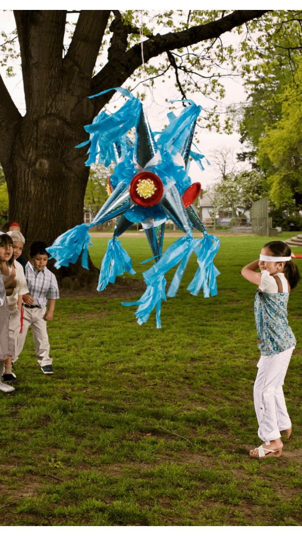 Blindfolded person attempting to hit a piñata, symbolizing the risk of ignoring concept testing in product development