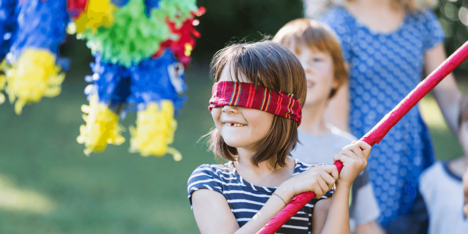 Blindfolded person attempting to hit a piñata, symbolizing the risk of ignoring concept testing in product development