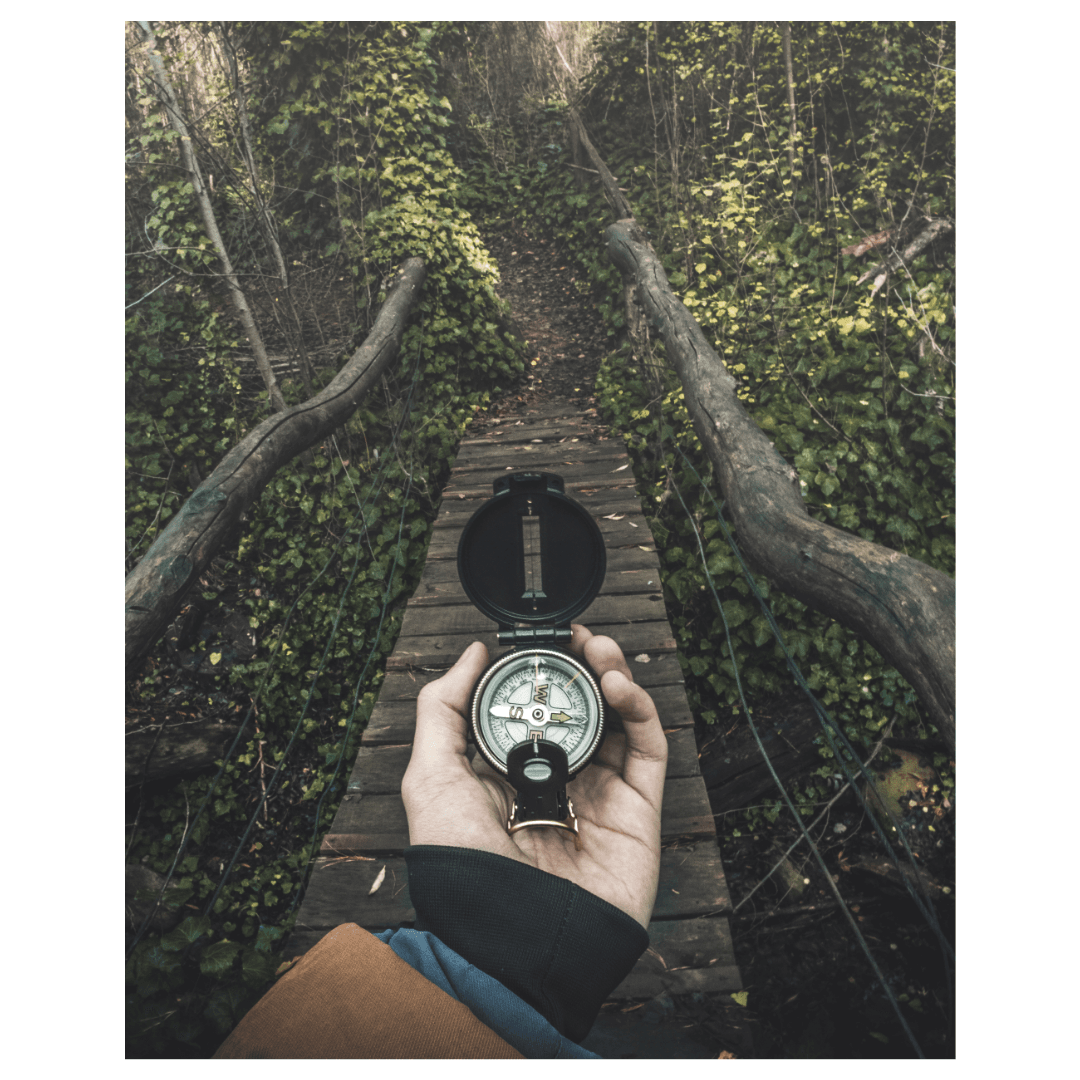 Person holding a compass, symbolizing how NPS guides product managers in understanding customer loyalty